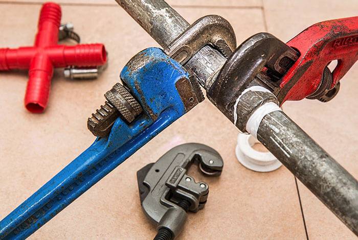Plumbing pipe wrench used during restoration and plumbing repair