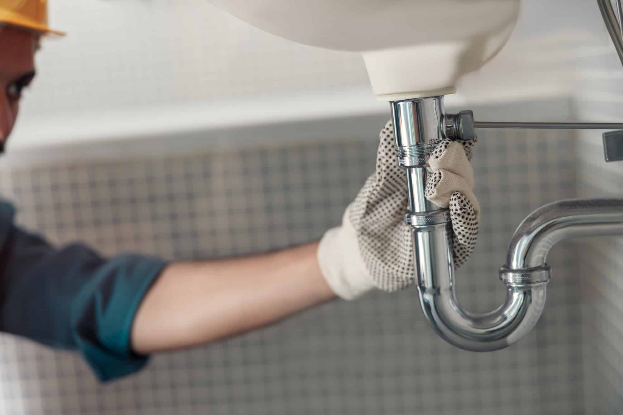 Plumber repairing bathroom faucet – quality plumbing repair by My Dry Team