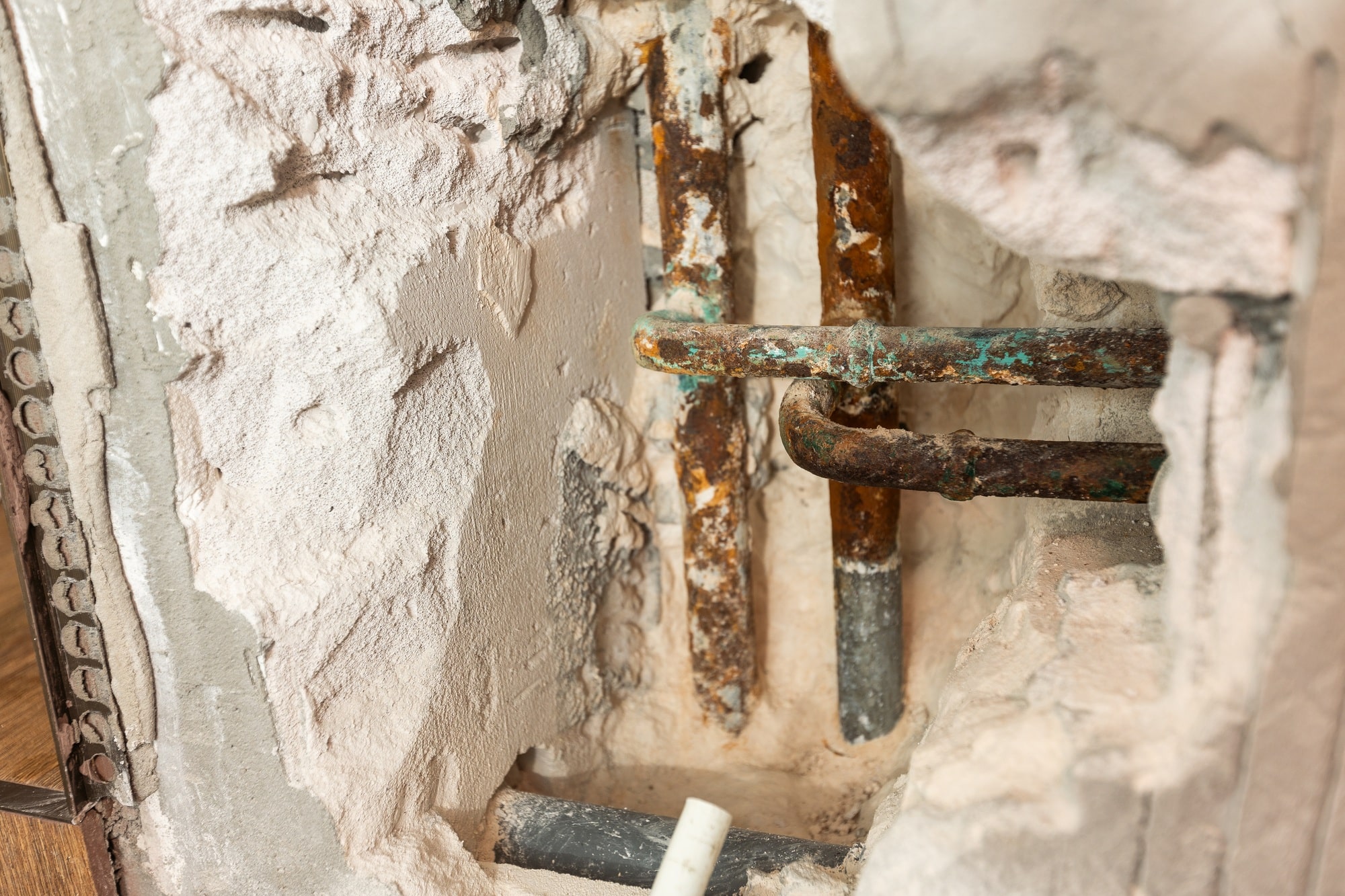 Water leak from damaged piping system in restroom wall – My Dry Team emergency repair